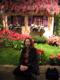 Alyce in front of cottage (Click to enlarge)