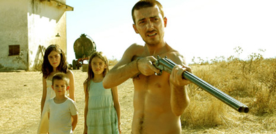 Victor Clavijo uses a rifle to protect his family from intruders in "Before the Fall"