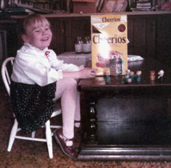 My sister with a Cheerios box (Click to enlarge)