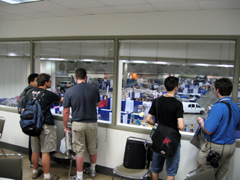 Press looking at dealers' room (Click to enlarge)