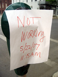 Sign on a broken meter (Click to enlarge)
